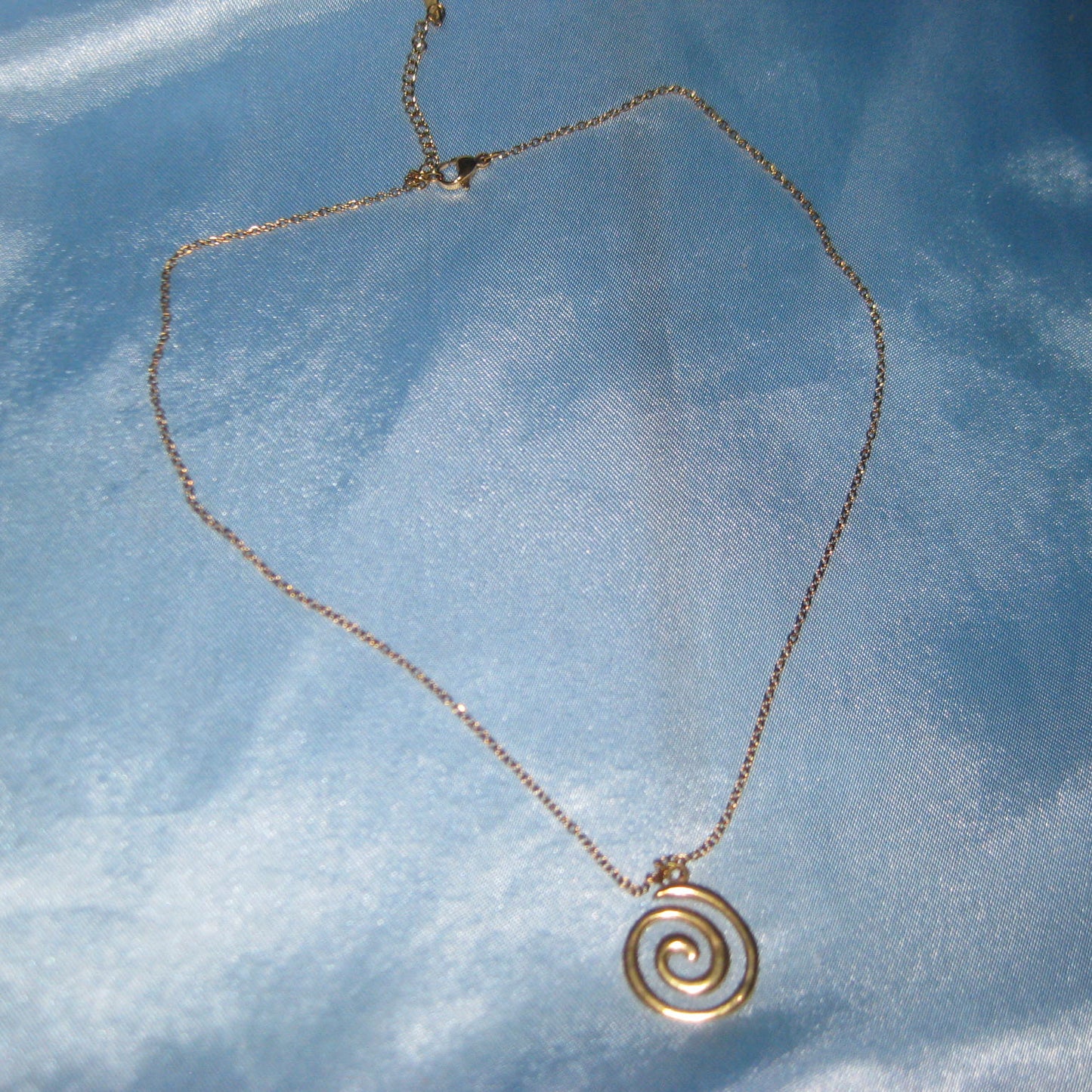 thin chain golden spiral necklace