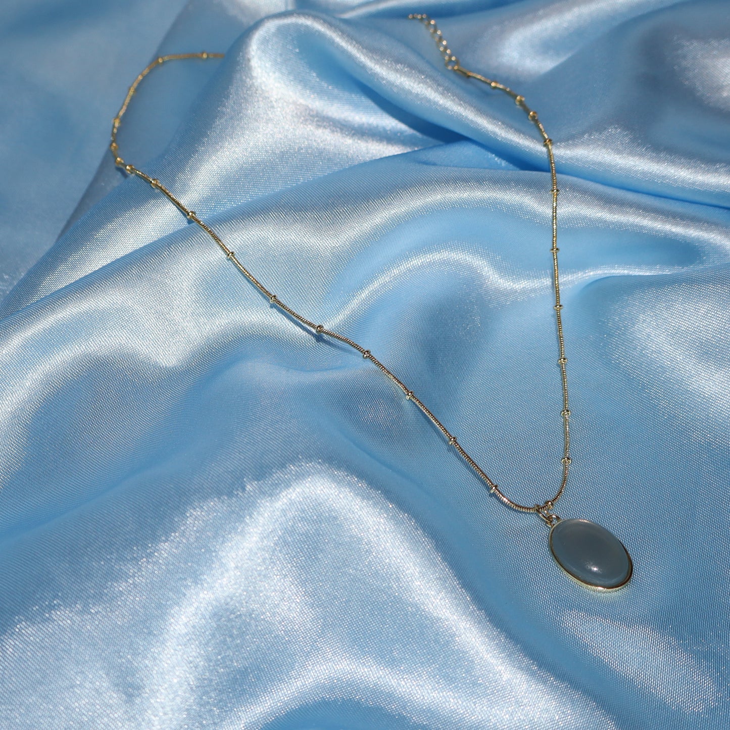 gold cadet blue pendant necklace