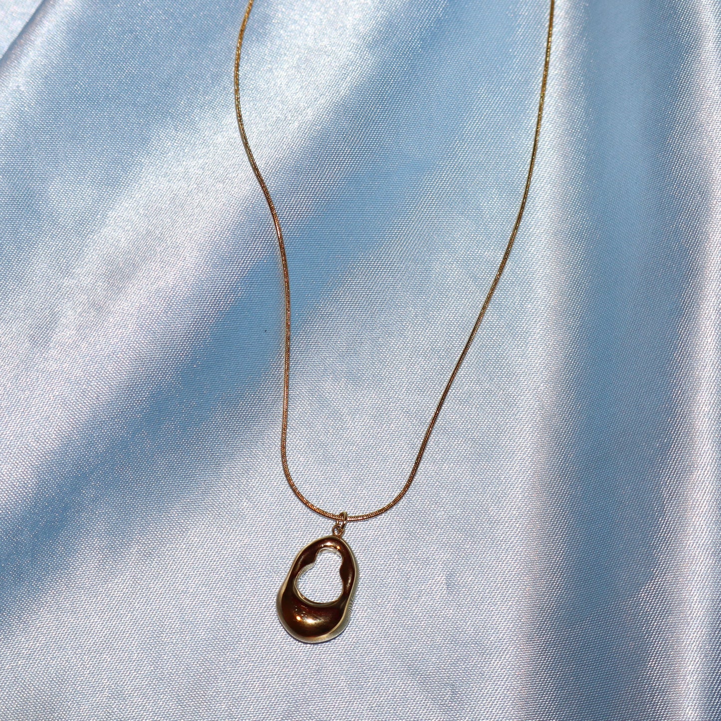gold open oval necklace