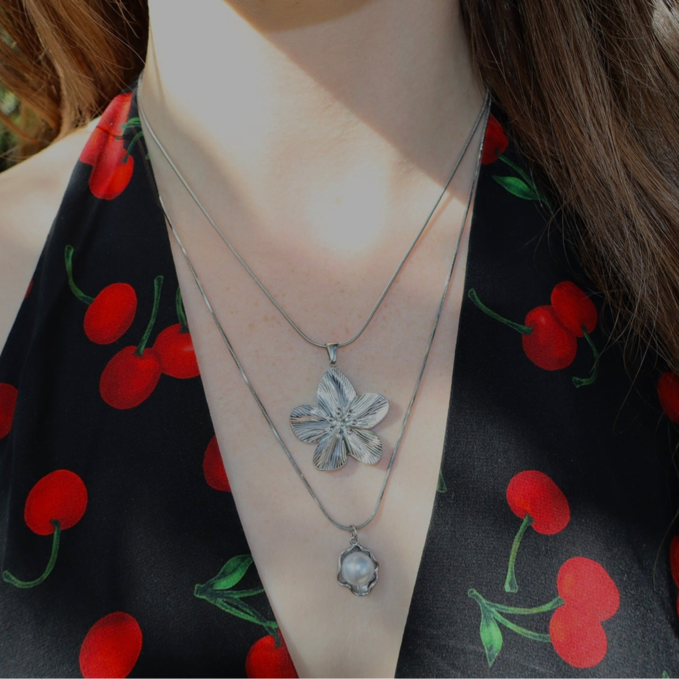 2 silver necklaces, pearl and flower stack