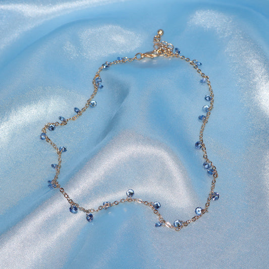Light blue stone, gold necklace